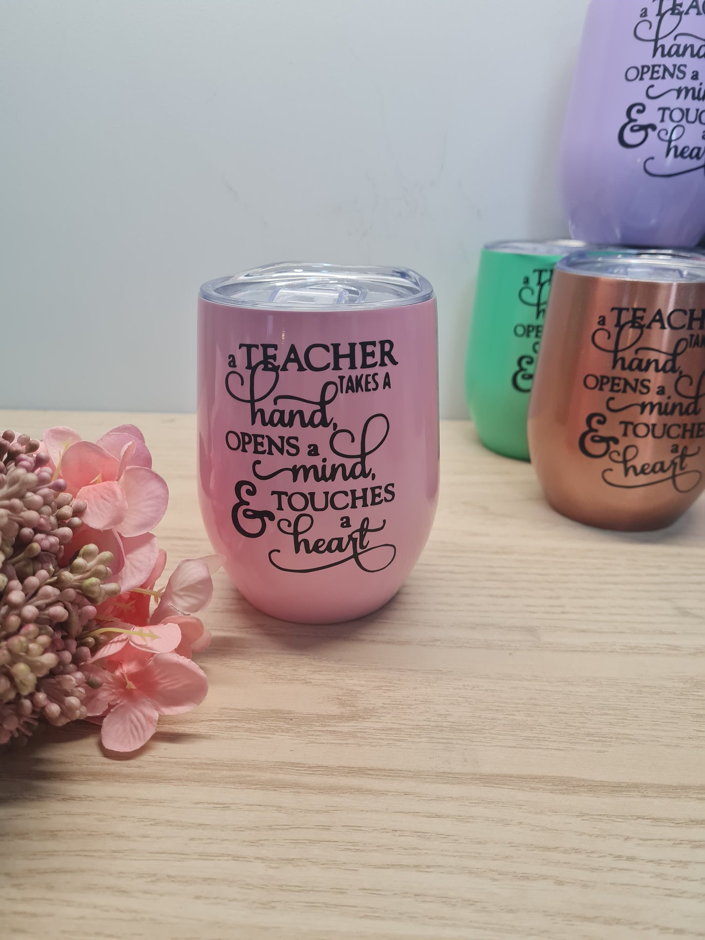 A Teacher Touches a Heart Tumbler