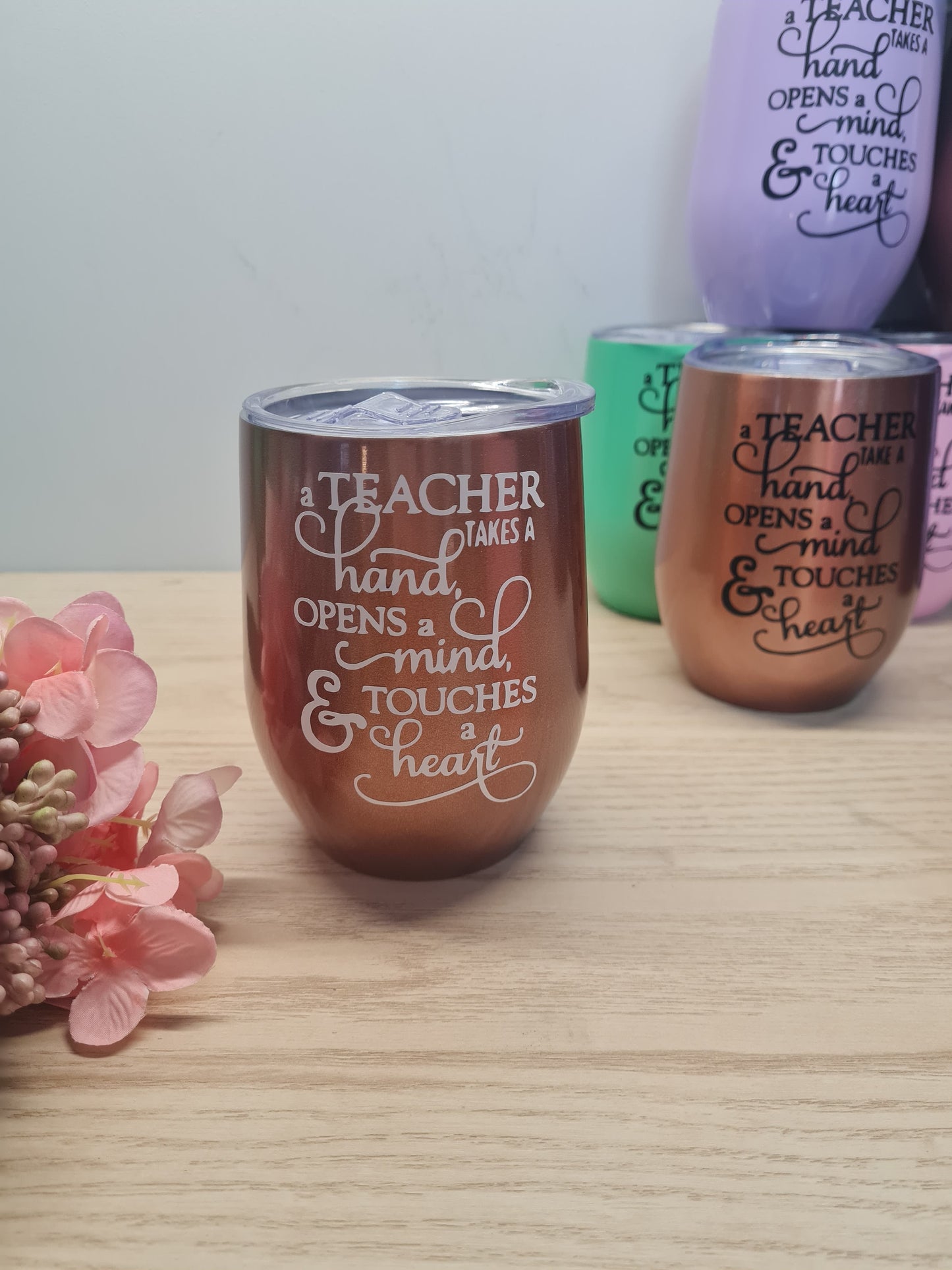 A Teacher Touches a Heart Tumbler