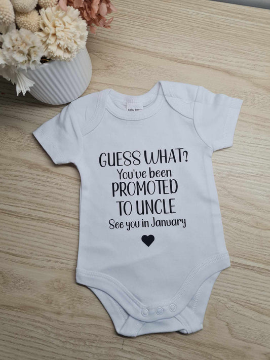 Guess What Onesie